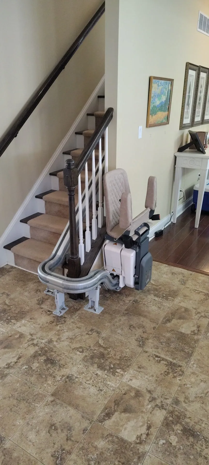 Curved stairlift rail following a turning staircase in West Bradford Township, PA