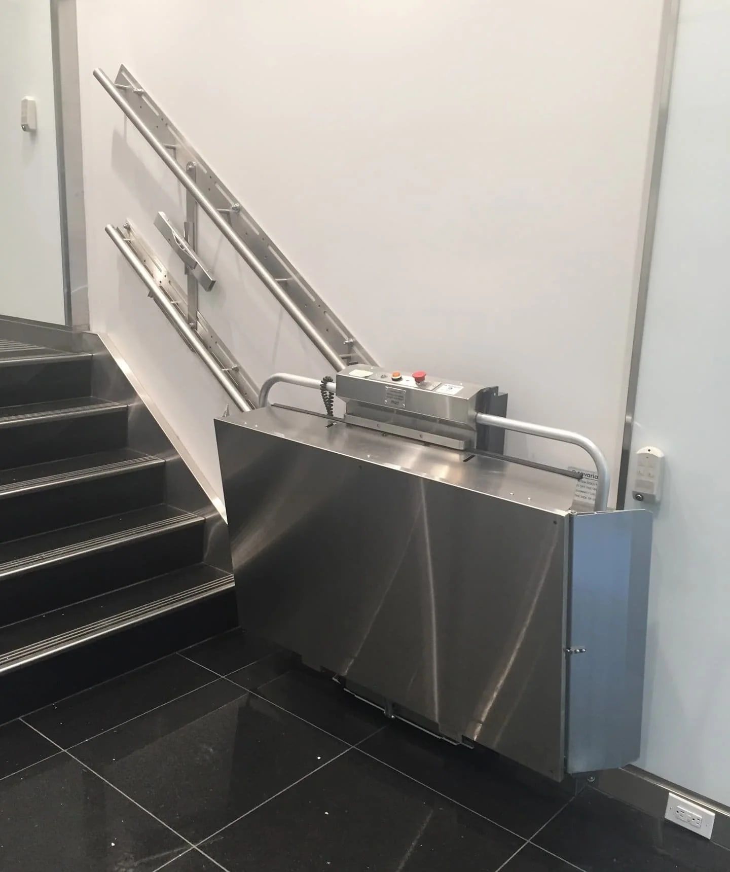 Savaria Delta inclined platform lift folded against the wall