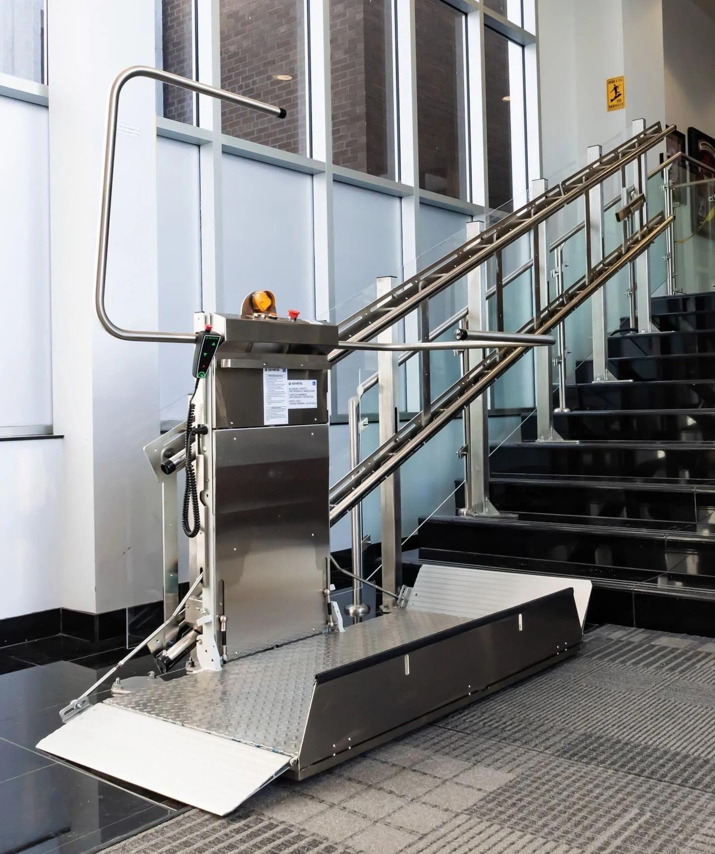 Savaria Delta inclined platform lift unfolded on a staircase
