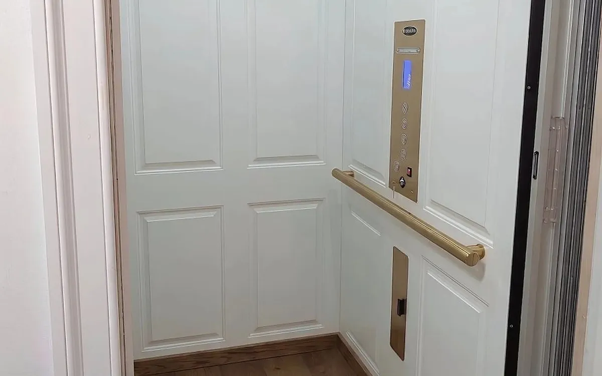 Savaria Eclipse home elevator with white paneled cab installed in Ambler, PA