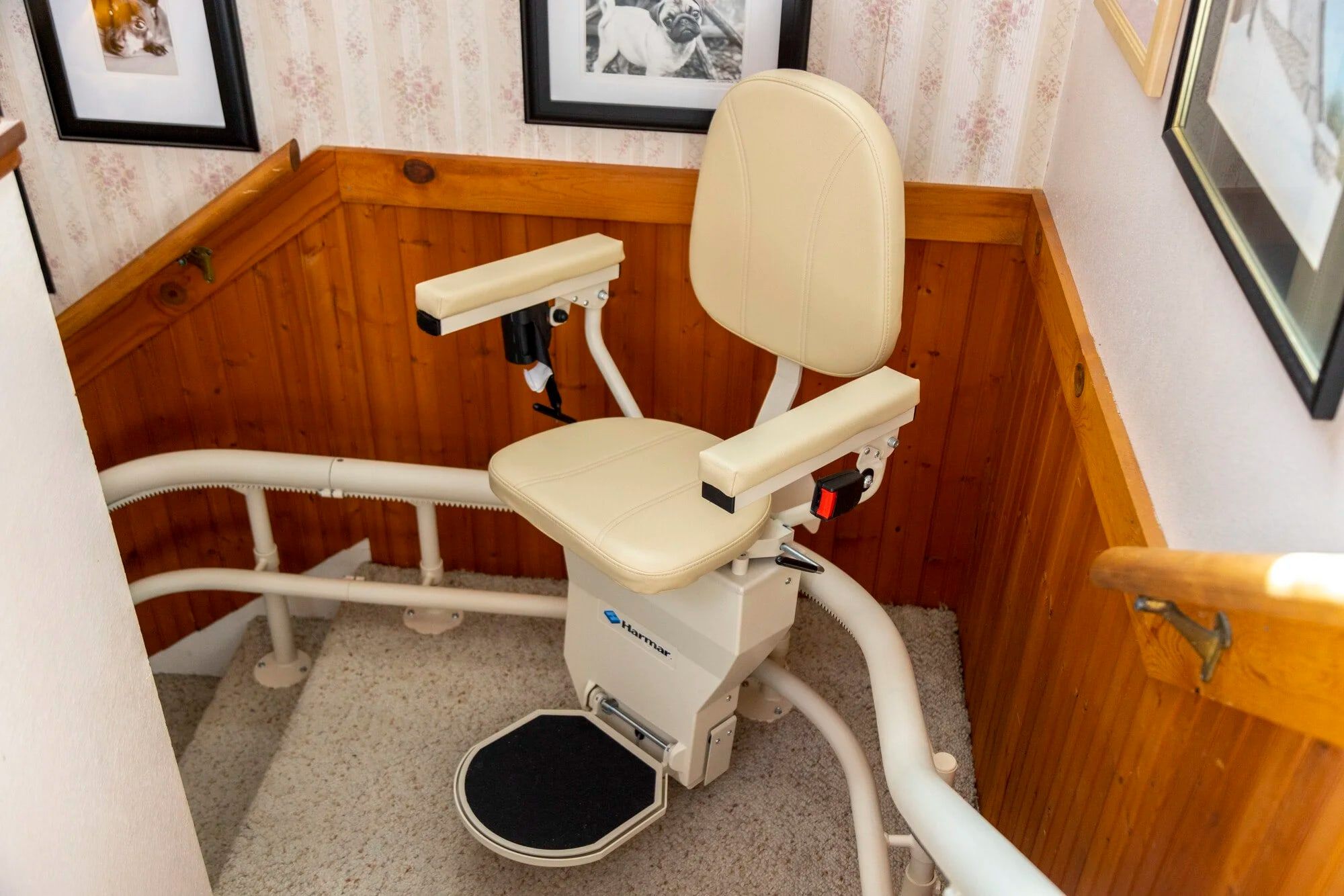 Harmar Helix curved stairlift rounding a staircase landing