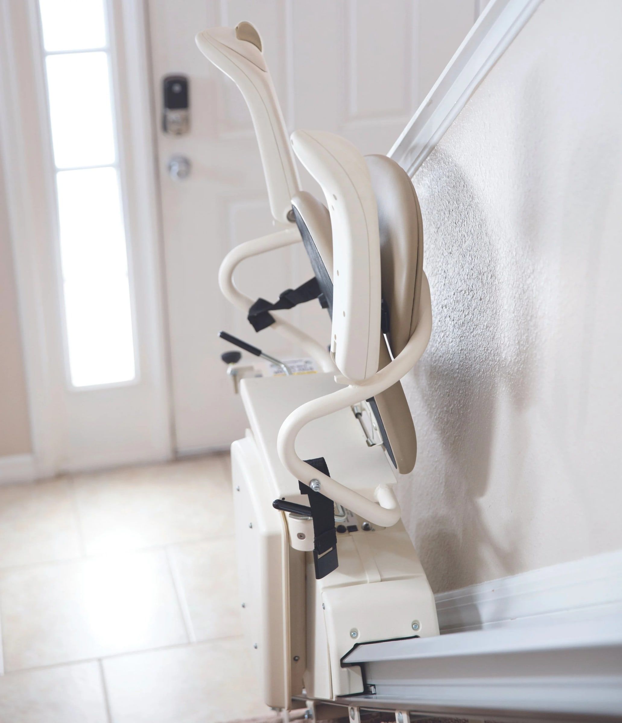 Harmar SL300 stairlift folded against the wall