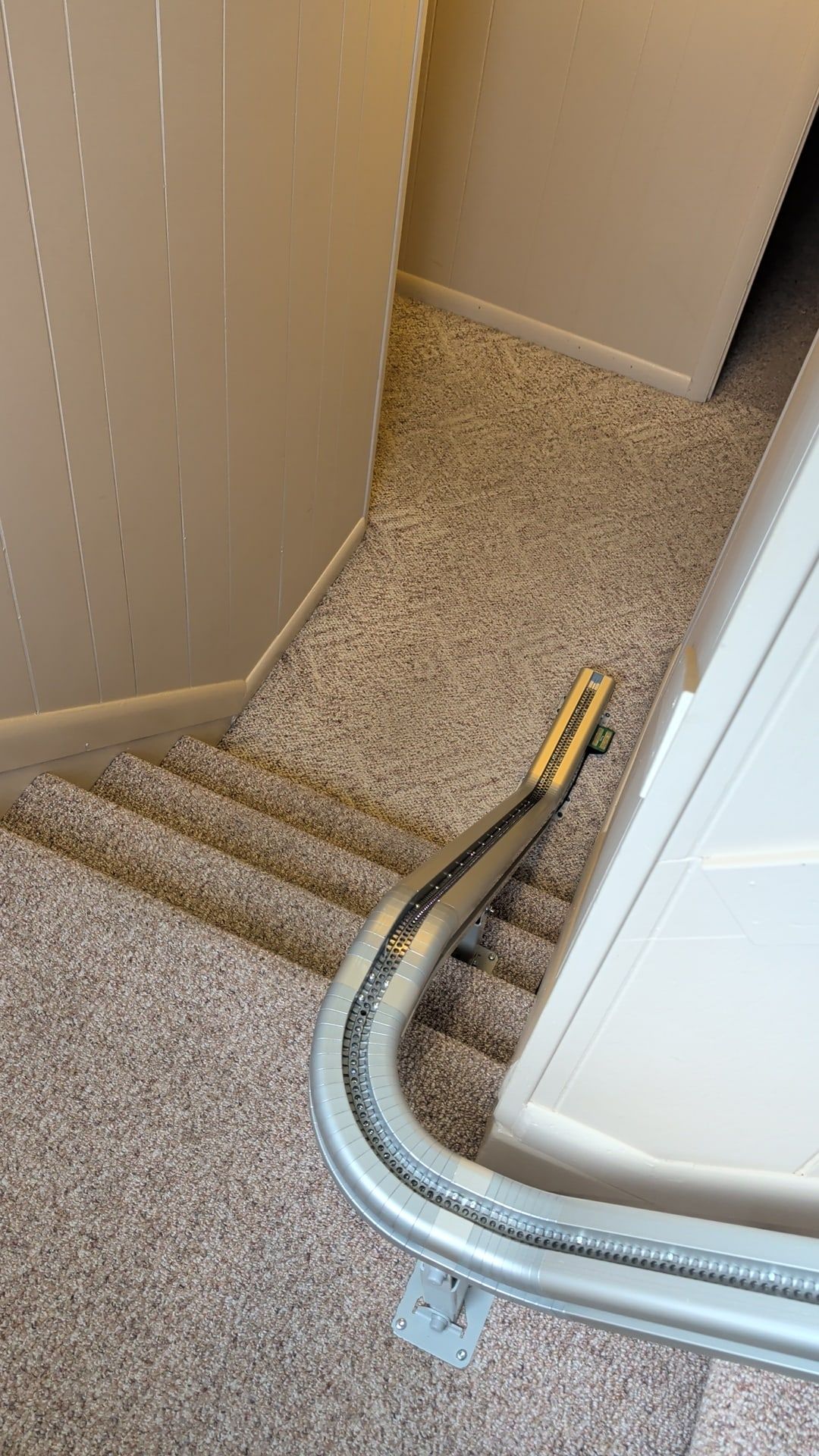 Curved stairlift rail installed on a carpeted staircase in Camp Hill, PA