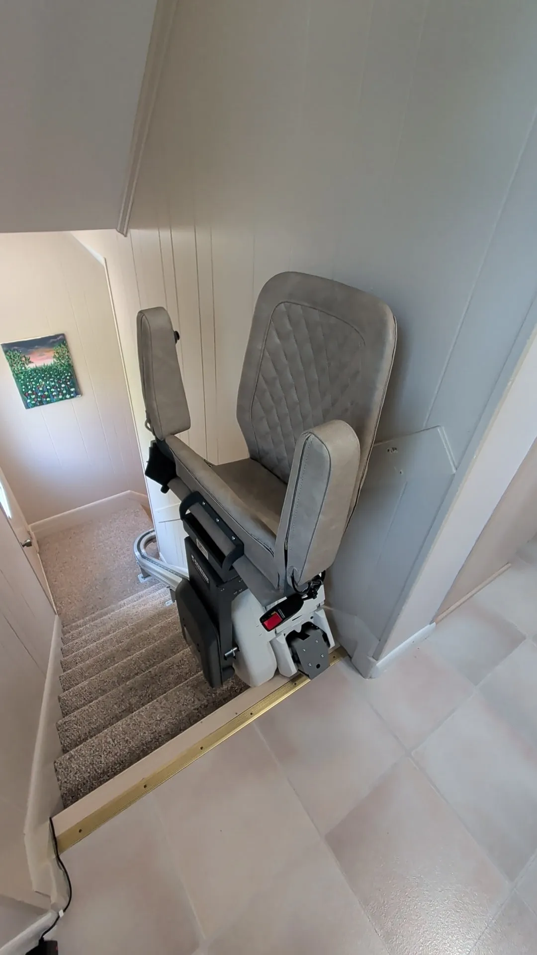 UP Stairlift in grey upholstery installed on a curved staircase in Camp Hill, PA