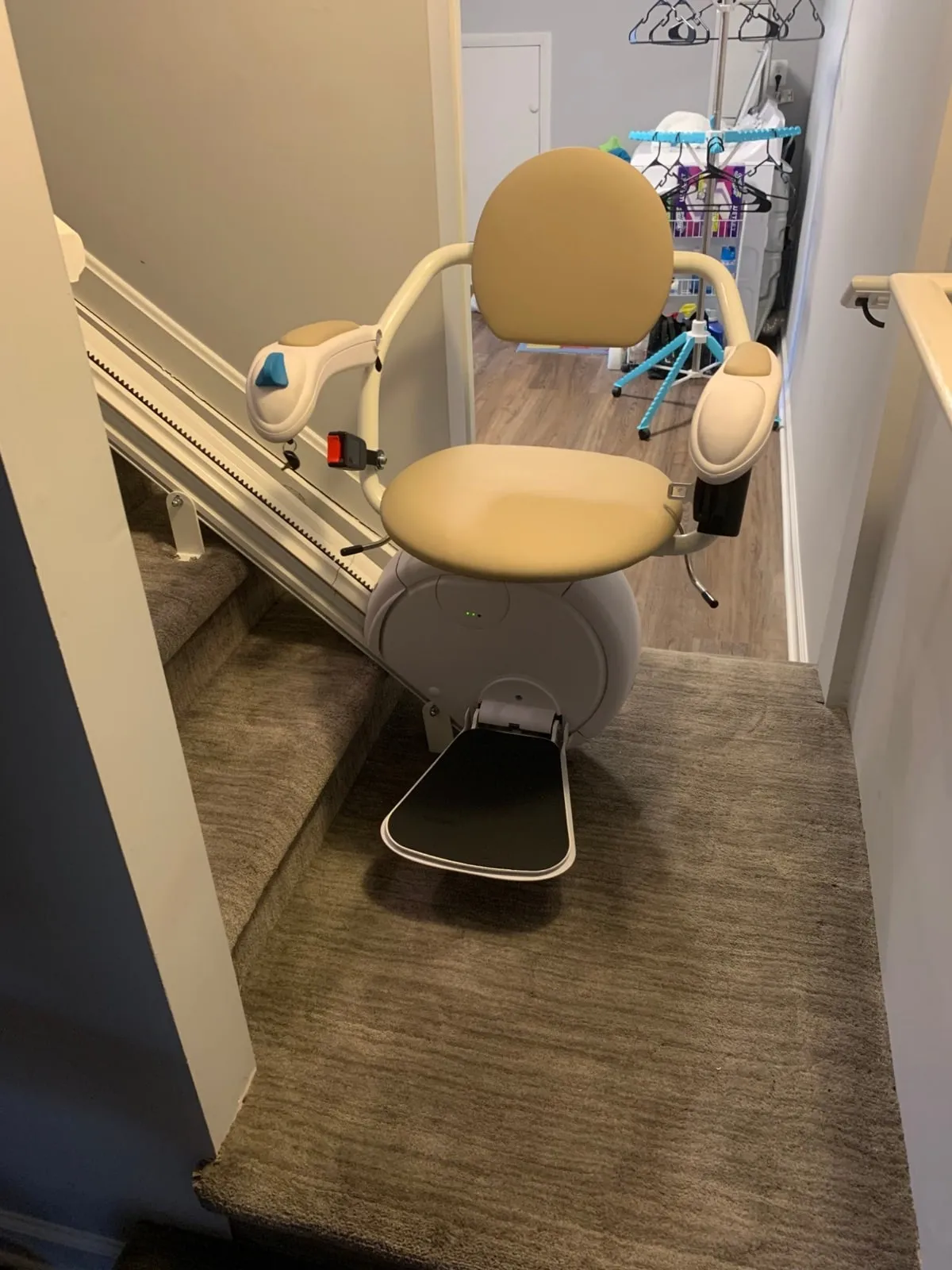 Savaria K2 stairlift at a landing on a carpeted staircase in central Pennsylvania