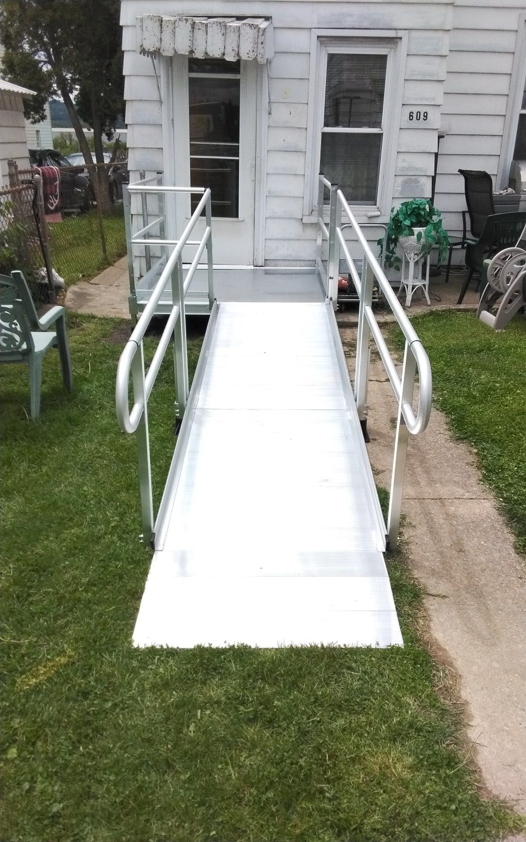 Modular ramp with handrails to a front porch in Steelton, PA