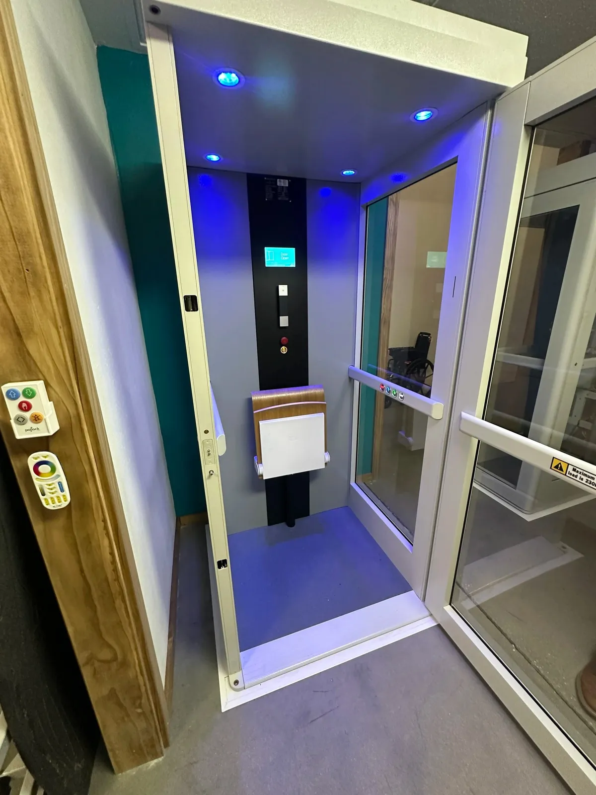 Pollock shaftless home elevator with a glass side door installed in a Pennsylvania home