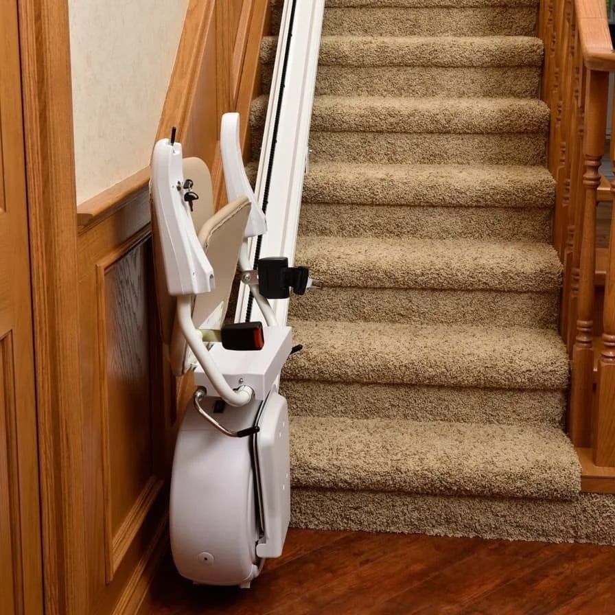Savaria K2 stairlift folded against the wall showing its slim profile