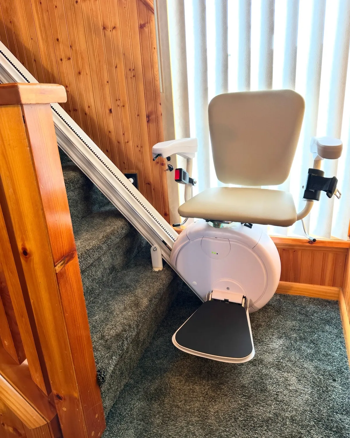 Savaria K2 stairlift installed on a straight carpeted staircase in a Pennsylvania home