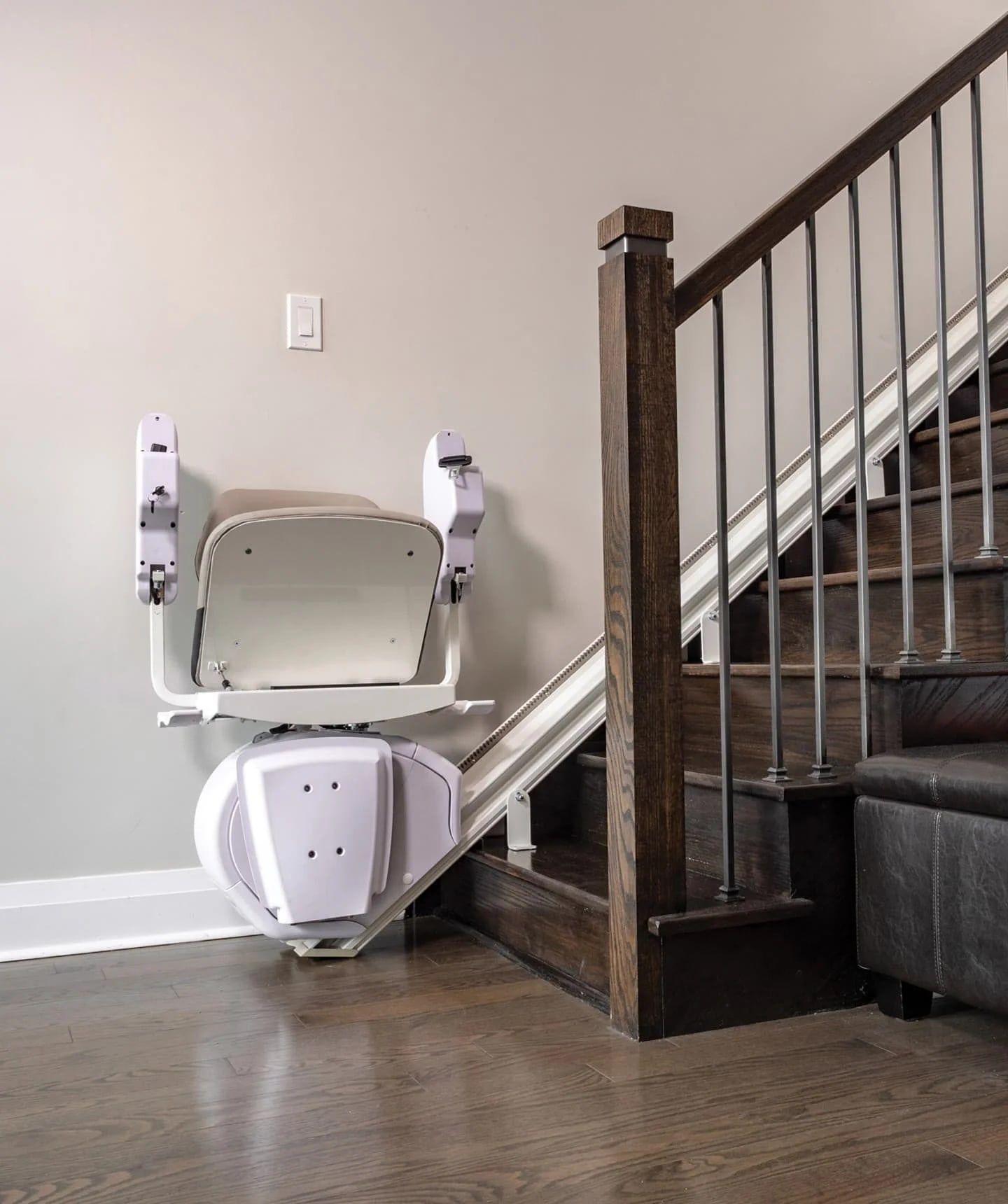 Savaria K2 Plus stairlift folded at the top of the stairs
