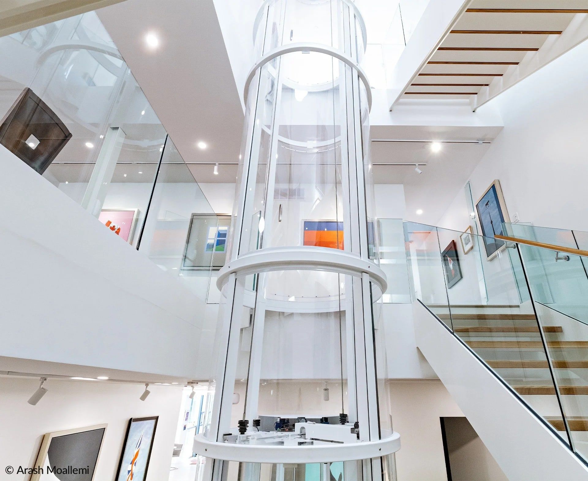 Savaria Vuelift round glass elevator in a white house