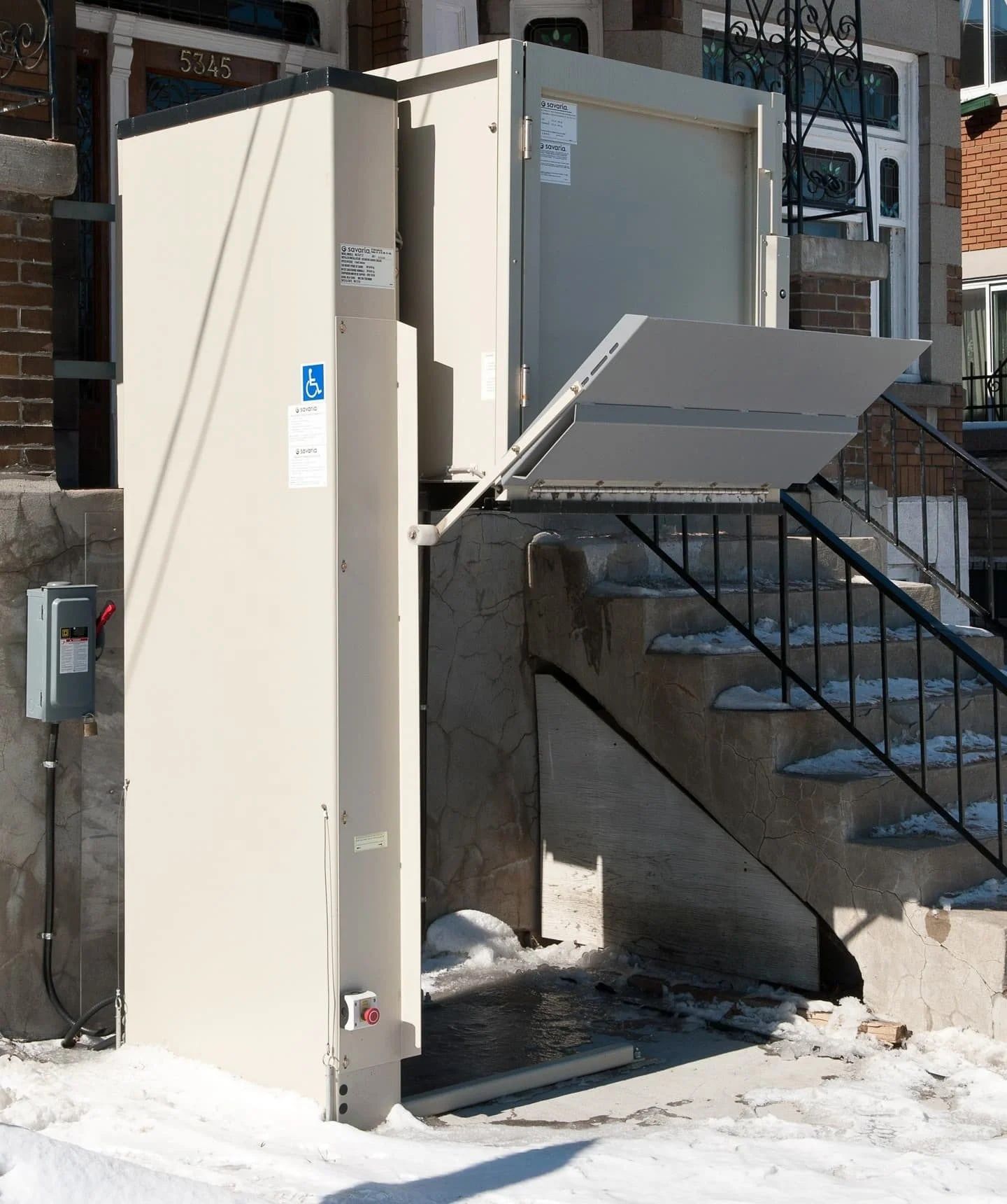 Wheelchair platform lift at a residential entrance